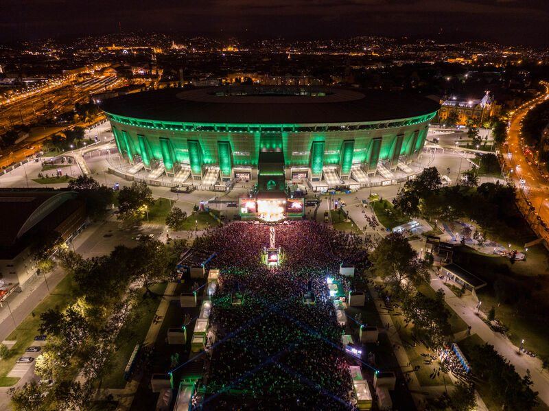 Aerial view of a concert outside Puskás Aréna at night